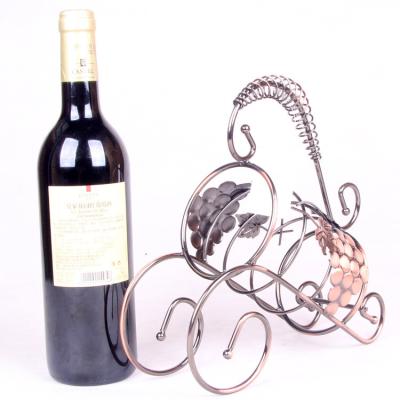 China Party Decoration Viable Courage Creative Wine Display Rack Holding A Bottle Metal Wine Rack for sale