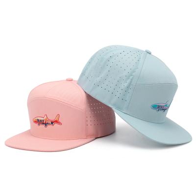 China Custom High Quality Fashion COMMON Logo Melin Luxury Flat Bill 7 Panel Fish Embroidered OEM Laser Cut Perforated Hole Hat Snapback Hat for sale