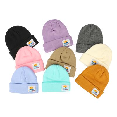 China Custom Made Fashionable Adult Bulk Acrylic Knitted Hat COMMON Beanie With Woven Label Colorful Moq Winter Hat Skull for sale