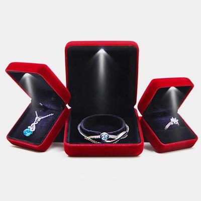 China Custom Elelgent LED Ring Box Logo With Wedding Ring Jewelry Box Red LED Light Cheap Pin Light Box for sale