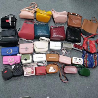 China Factory Wholesale Cheap High Quality PU Leather Tops In Stock 1$ Discount Bag for sale