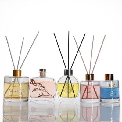 China Hot Stamping Empty Round Reed Diffuser Bottle Personal Care Wholesale Fancy Decal Aroma Bottle Glass for sale