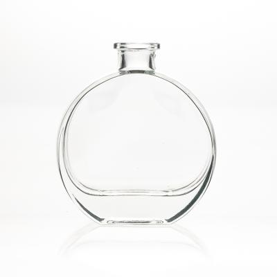 China Fashionable Women Cosmetic Fancy Flat Round Packaging 100ml Perfume Bottle Clear Empty Glass Bottle Diffuser for sale