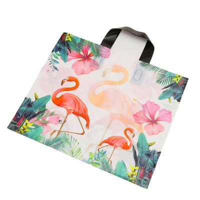 China Recyclable High Quality Flower PE Plastic Gift Shopping Apparel Package Bags For Party Supply Christmas New Year for sale