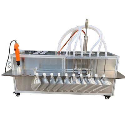 China Semi Automatic 2/4/6 Spouts Commodities Standing Spout Pouch Machine Drinking Water/Juice/Milk/Drinking Doypack Filling Capping Filling Machines for sale