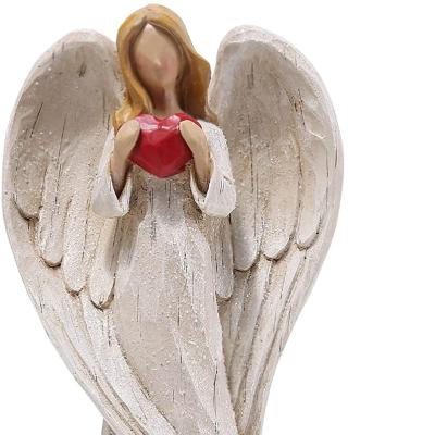 China Europe Holy Religious Resin Praying Angel Sculpture Statue Exquisitely Carved with Wings and Red Heart Home Decoration Crafts for Gifts for sale