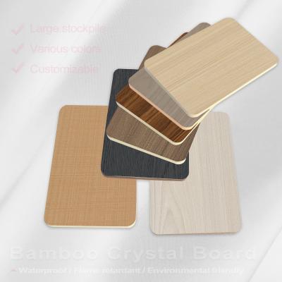 China Painel de parede de PVC de 8 mm Decorativo Impeligroso Folheado de madeira de fibra de bambu Painel de parede sem costura à venda