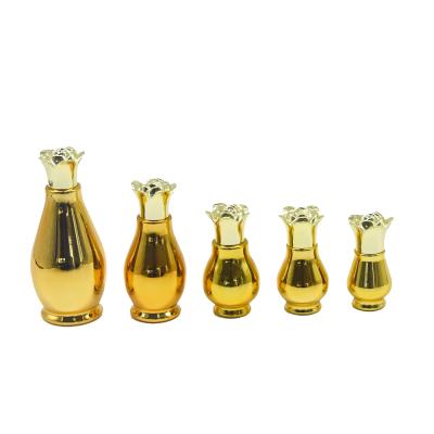 China Luxury Liquor Bottles 10ml 20ml 30ml 50ml 100ml Perfume Pumpkin Gold Lotion Essential Oil Custom Glass Bottle for sale