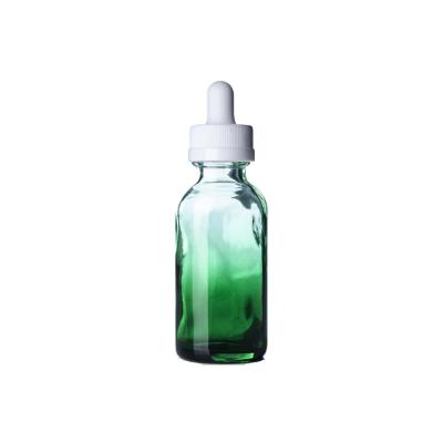 China Luxury Liquor Bottles 1 Ounce Glass Boston Round Bottles Glass Green Shaded Pipette With White Rubber Bulb for sale