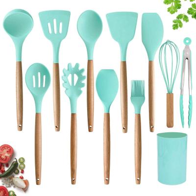 China Sustainable Kitchen Cooking Tools Non Stick Cookware With Natural Wooden Handles Silicone Cookware Set for sale