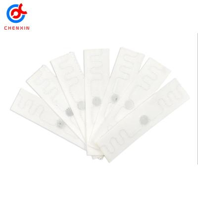 China 75*15mm Waterproof / Waterproof 200 Times Washable Ucode 8 Chip Uhf Textile Laundry Washable Rfid Tag for sale