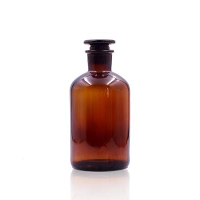 China Custom amber empty medicine glass bottle 60ml/125ml/250ml/500ml/1000ml medicine hot sale with glass cork for sale