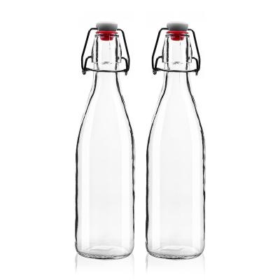 China 250ml Factory Recyclable Hot Sale Round Shape Free Sample Custom Empty Glass Bottle With Clip For Milk Juice Beverage Liquor for sale