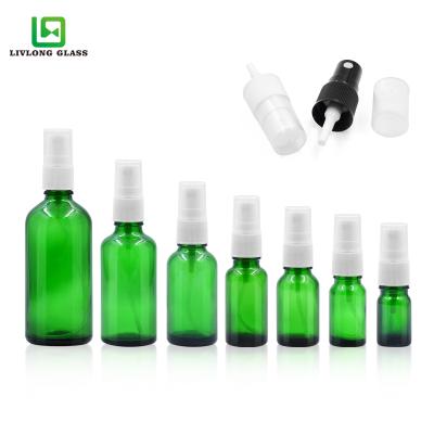 China 5ml 10ml 15ml 20ml 30ml 50ml 100ml Raw Material Essential Oil Cosmetic Shiny Green Glass Bottle With White Spray Head for sale