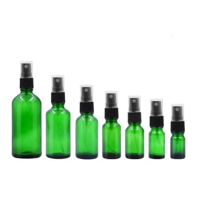 China Cosmetic Green Glass Spray Bottles 5ml 10ml 15ml 20ml 30ml 50ml 100ml Essential Oil Container Glass Cosmetics Bottles for sale