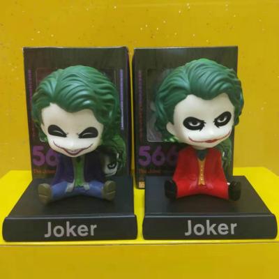 China 4 inch hot sale cartoon toy in car shaking toy car decoration joker head figure shaking head toy for sale