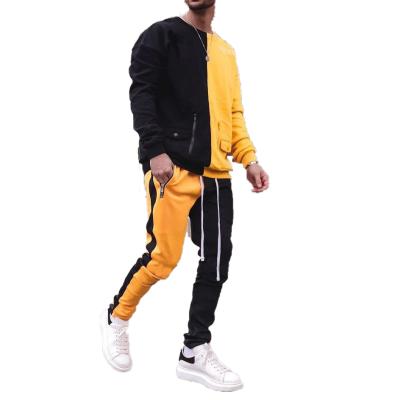 China QUICK DRY Custom Color Block Gym Suit Fashion Sweat Suit Design Logo Slim Fitness Jogger Set Male Sportswear Patchwork Tracksuit Men for sale