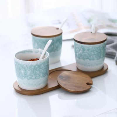 China Sustainable Household Round Kitchen Storage Ceramic Jar Set Three Piece Suits Salt Shakers Come With Boards for sale