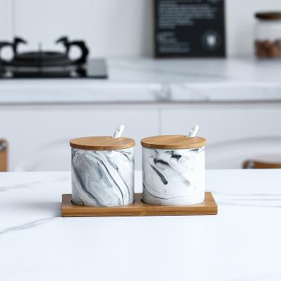 China New Design Sustainable Ceramic Spice Salt Jar Marble Seasoning Jar With Wooden Tray And Lid for sale