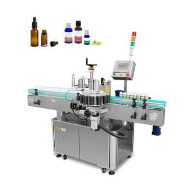 China High Speed ​​Automatic Food Sticker Positioning Self Adhesive Labeler for Cosmetic Round Bottles Placing Labeling Machine for sale