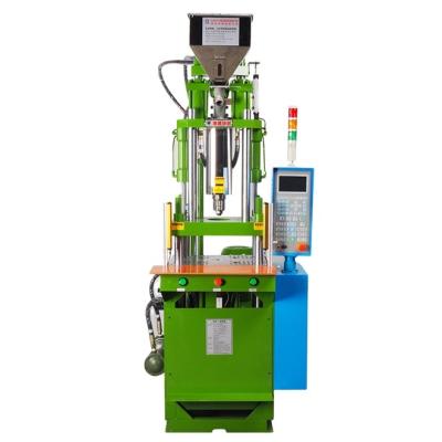 China Plastic vertical injection molding machine for USB making plug LED light making machine for sale