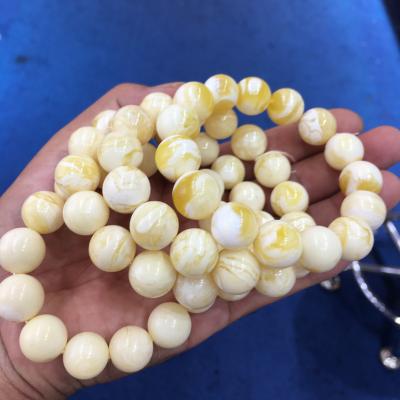 China AMBER High Quality Amber Beads Factory Outlet Bucket Russian Natural Baltic Amber Golden White Bead Cutting Amber for sale