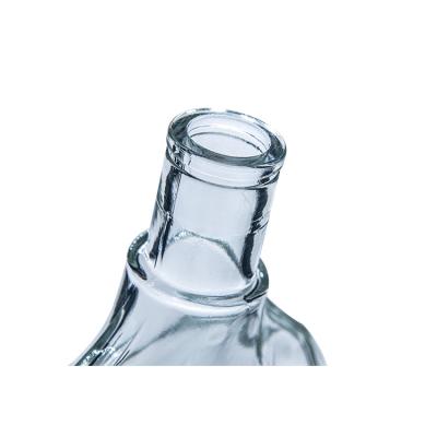 China Unique Shaped Clear Glass Beverage 1Liter Flint Wine Bottle for sale