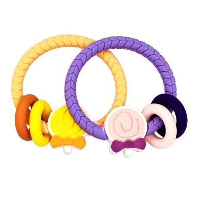 China YXT-BT-51 Chewable Shape Cute Cartoon Kids Purple Orange Candy Shape Silicone Baby Teether Ring for sale