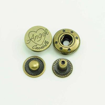 China Custom Engraved Dry Cleaning Logo Metal Round Spring Snap Button for sale