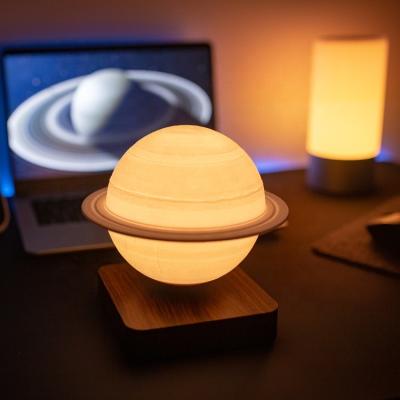 中国 Minimalist Drop Shipping Innovative Desk Table Magnetic Levitating Lamp Floating LED Light Jupiter Mars Saturn Moon Reading 販売のため