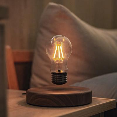 中国 Modern Minimalist Home Decor Luxury Eye Protect Reading Magnetic Levitation Table Lamp Light Bulb Floating Home Light 販売のため