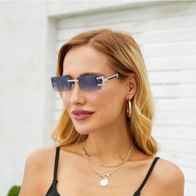 China Fashion Anti UV400 Sunglasses New Rimless Design Retro Imitated Wood Lenses Brand Designer Ladies Rhinestone Sun Glasses for sale