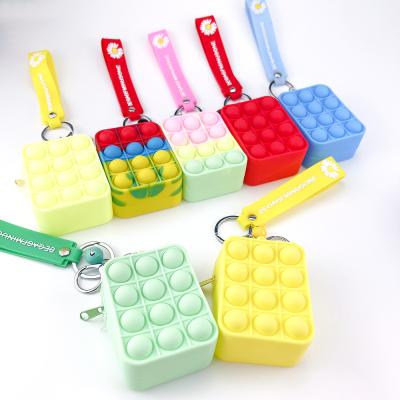 China Eco-Friendly Decompression Soft Silicone Storage Bag Hot Selling Key Chained Person Toys Push Bubble Toy Stress Sensory Relief for sale