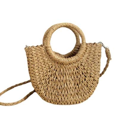 China Popular 2023 Fashion Minimalist Style Ins Models Half Around Straw Package Beach Hand Woven Bag Vacation Women Bag for sale