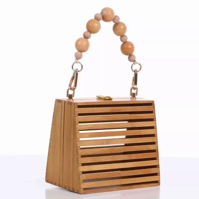 China Best Selling Summer High Quality Semicircle Hollow Out Clutch Purse Handbags Straw Bag For Women Bamboo Beach Bag for sale