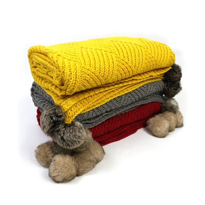 China Sustainable soft and comfortable fat handmade knit blanket knitted adult blanket with pom poms for sale