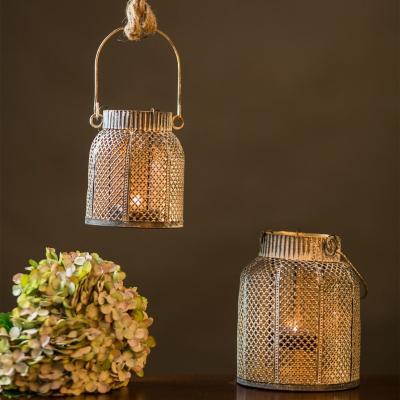 China Retro Lantern Candle Holder European Metal Wire Glass Hollowed Out Wind Lamp Candle Lantern Holder for sale