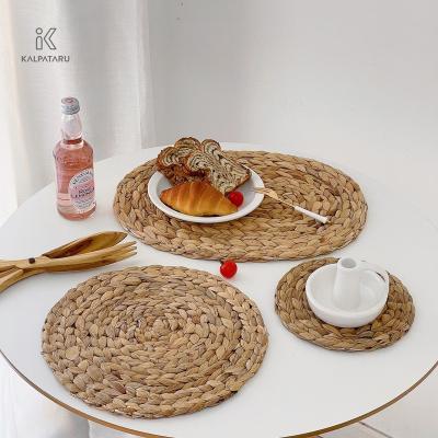 China Water hyacinth place mat household multi-size woven round table mat sustainable woven table mat custom for sale