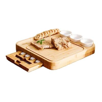 China Sustainable Natural Bamboo Cheese Board Four-Piece Knife Set With Drawer Type Bread Cheese Slicer Tray for sale