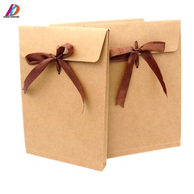 China Custom Gift Envelope Brown Kraft Paper Envelope Mailing Bag With Ribbon Handle For Clothing for sale