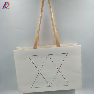 China Biodegradable Customized Luxury Paper Bag Shopping Bags With Stamping Logo for sale