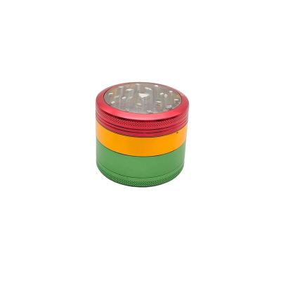 China Tobacco Use Only KushKrush 2.5 Inch 4 Piece Rasta Tops Herb Grinders With Pollen Catcher Clear for sale