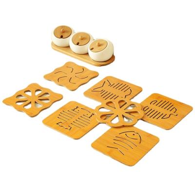 China Wooden Animal Insulated Table Mat Kitchen Carved Pan Pad Anti-slip Non-slip Viable Cartoon Cavity Place Mat 14~14.5cm for sale