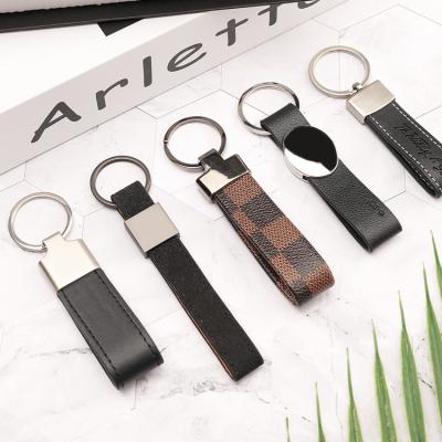 China Leather Keychain Factory 2020 Logo Designer Genuine Leather Keychain Custom Wholesale For Cars for sale