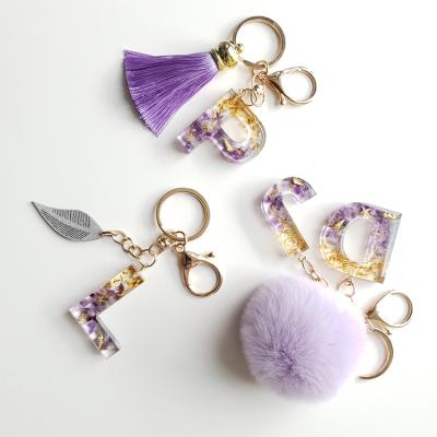 China Christmas gift set Wholesale Custom Fashion Initial Resin Letter Pom Pom Puff Ball Keychain Accessories for Women and Girls for sale