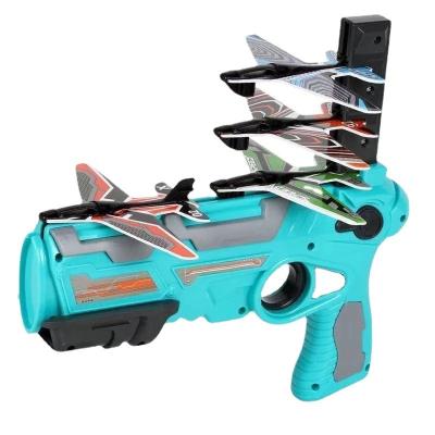 China Cute Gift M867 Bubble Catapult Toy Airplane Outdoor Toy With 4 Pcs Glider Foam One-click Ejection Aircraft Shooting Gun Flat Paper Model for sale