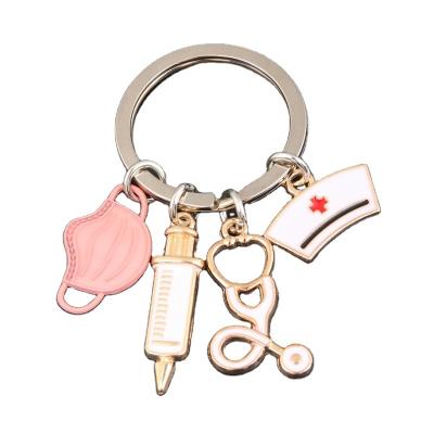 China Nice New Handmade Gift M075 Doctor Keychain Medical Tool Ring Injection Syringe Stethoscope Nurse Key Chain Hat Key Chain DIY Medical Jewelry for sale