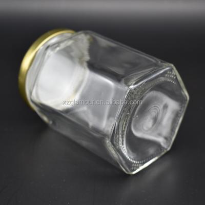 China Hexagonal Nuts 250ml 8oz Air Tight Glass Jar With Metal Hook Cap For Food for sale