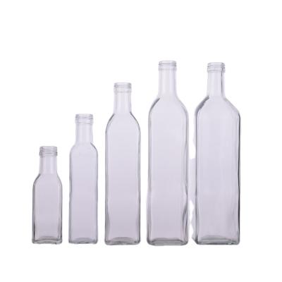 China Frying Oil Xuzhou Supplier Glass Olive Oil Bottles With Cork Canada Wholesale Clear Olive Oil Bottles With Caps for sale