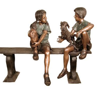 China Outdoor China Garden Metal Bronze Boys And Girls Sculpture With Dogs On Benches for sale